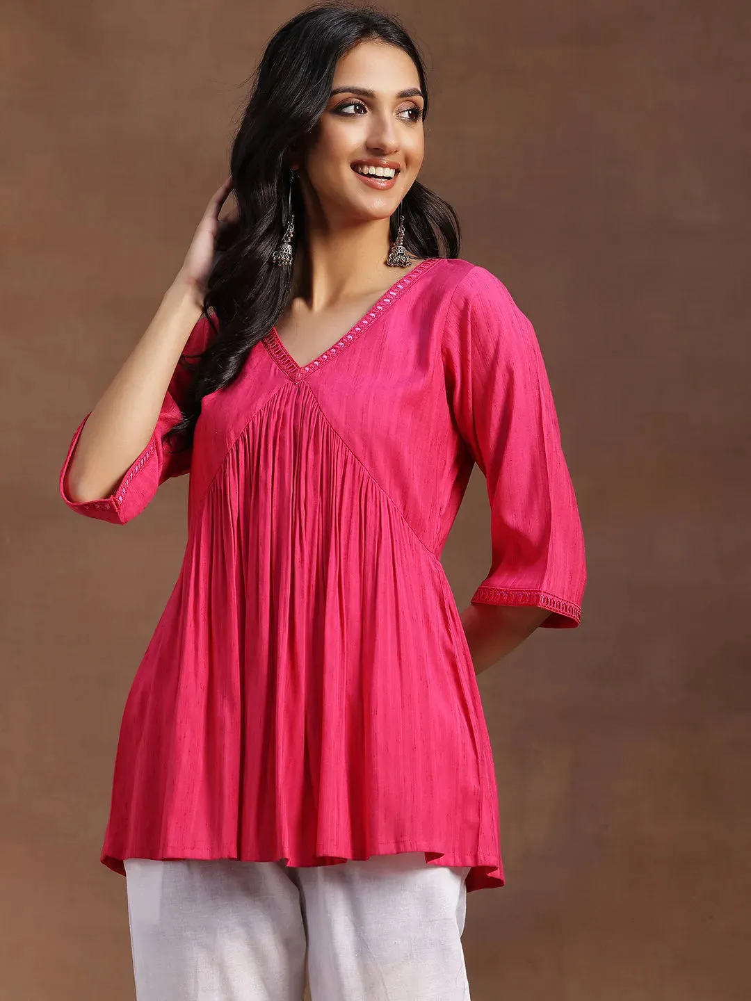 29146.Main_cd10f591-a5c0-4c38-80d4-3fa170b576af.webp Pink Solid Rayon A-line Kurti - Image 1